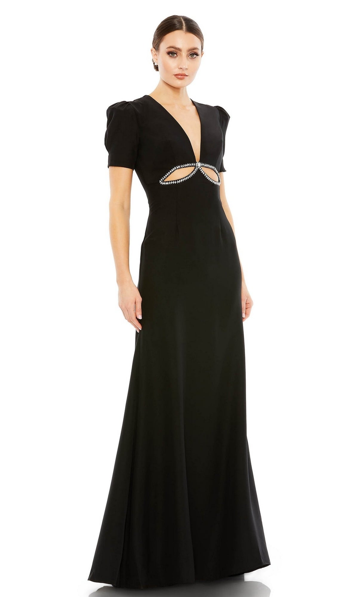 A woman wearing the Mac Duggal 2630 short-sleeve long formal dress, featuring a deep V neckline, waist cutout with sparkling rhinestones, and puff sleeves—an elegant black evening gown.